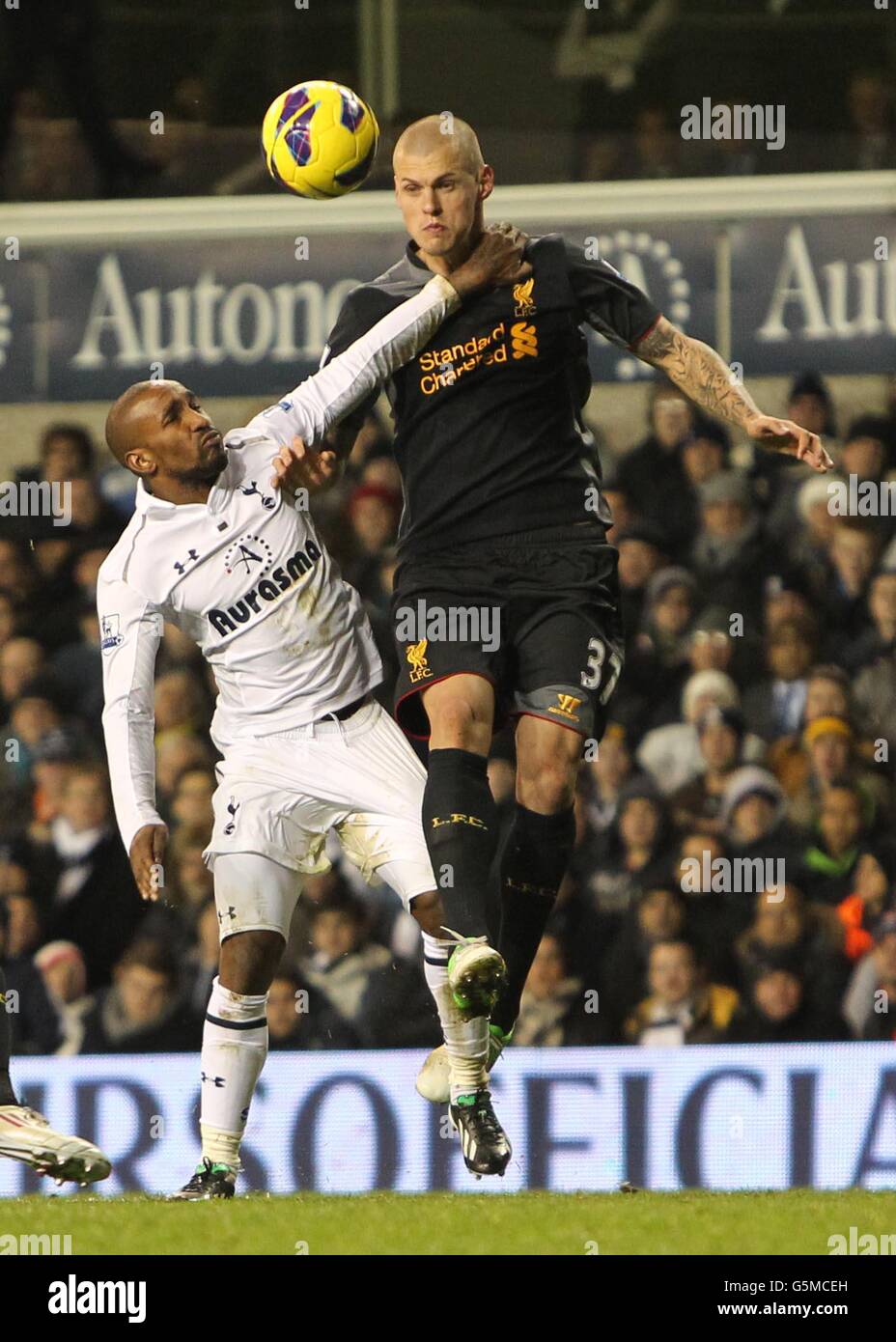 Tottenham's Jermain Defoe and Liverpool's Martin Skrtel (right) battle ...