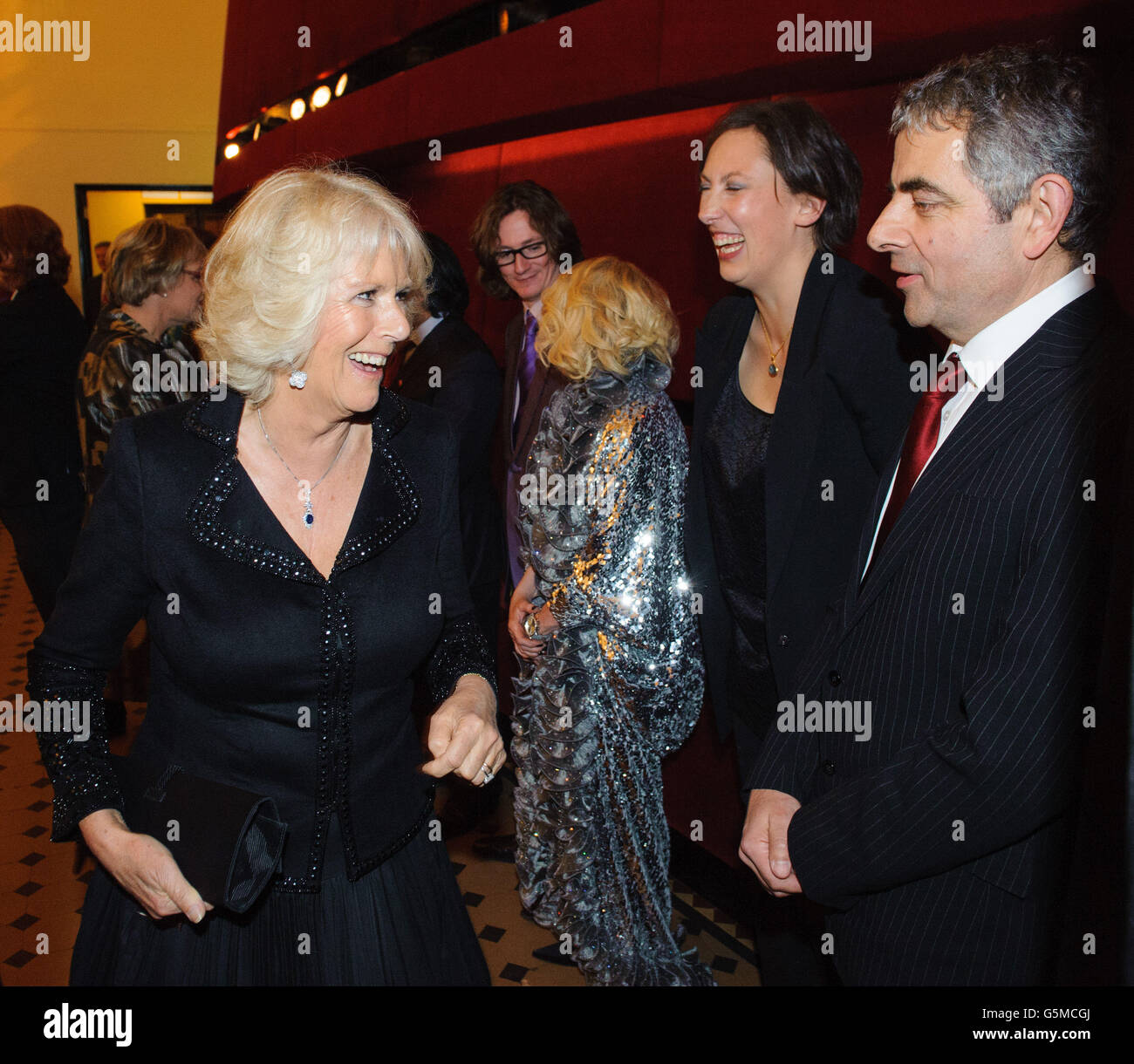 The Duchess of Cornwall meets performers Miranda Hart and Rowan Atkinson at the Prince's Trust Comedy Gala 2012, at the Royal Albert Hall, in central London. Stock Photo