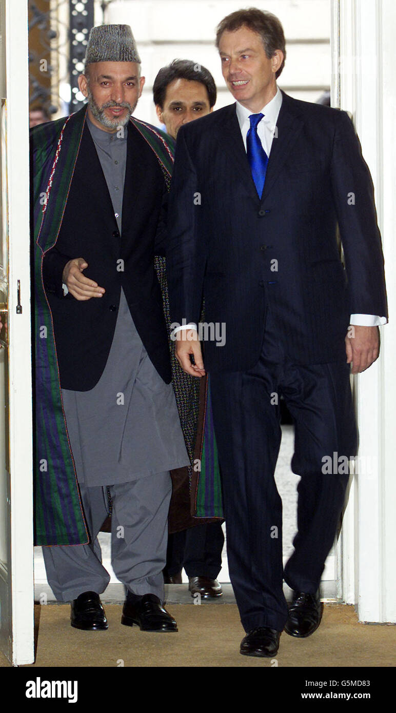 Britain's Prime Minister Tony Blair (R) welcomes the interim leader of Afghanistan Hamid Karzai into Downing Street in London January 31, 2002. Stock Photo