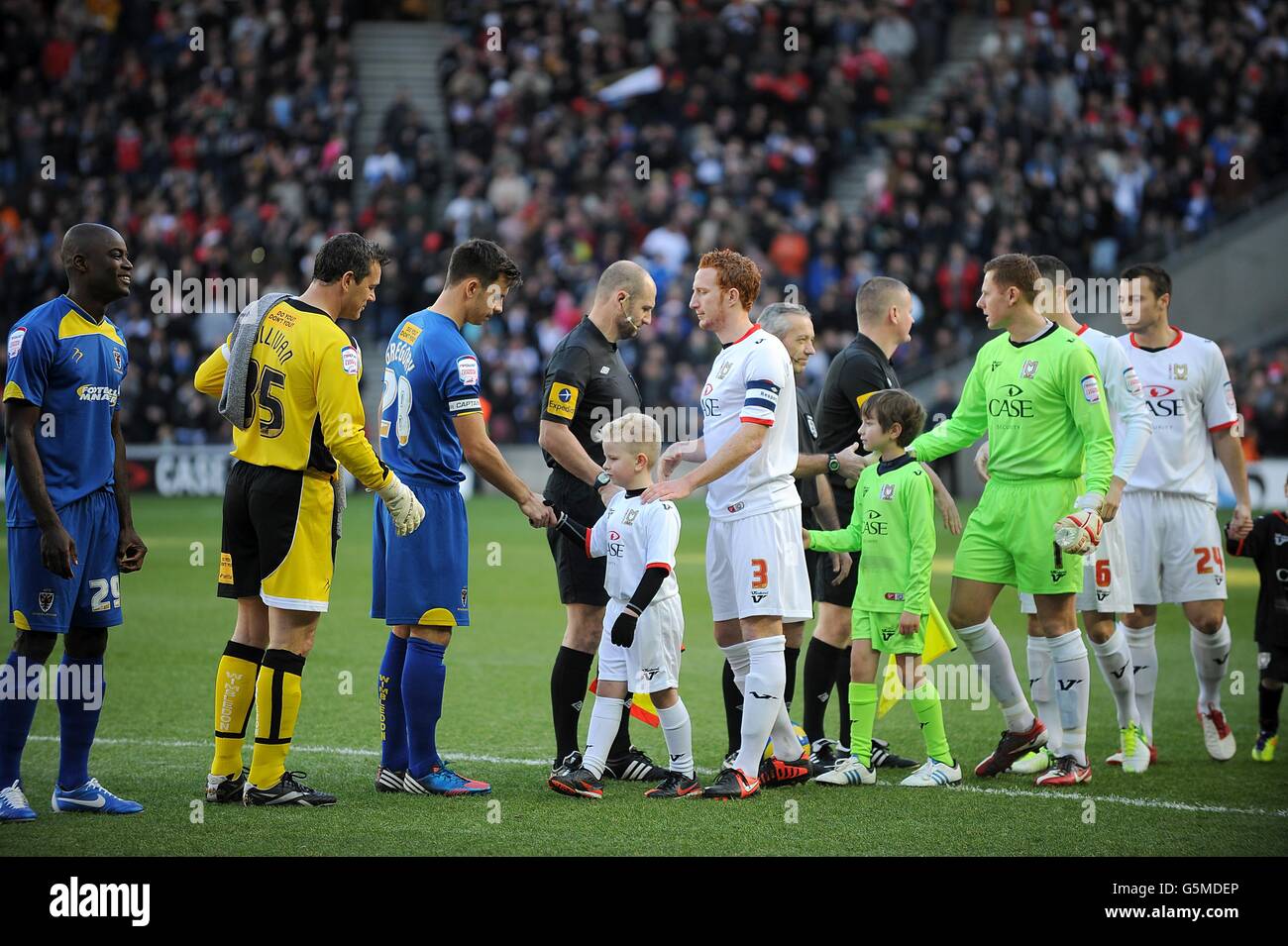 Milton dons players shake hands with afc wimbledon players kick off hi