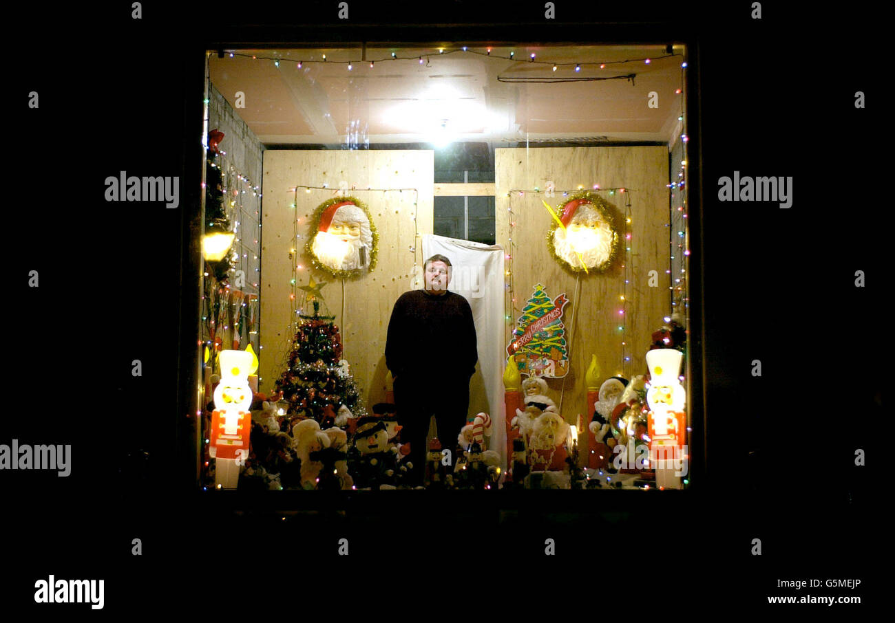 David Rowlands, 51, stands in the festive grotto he has created in his