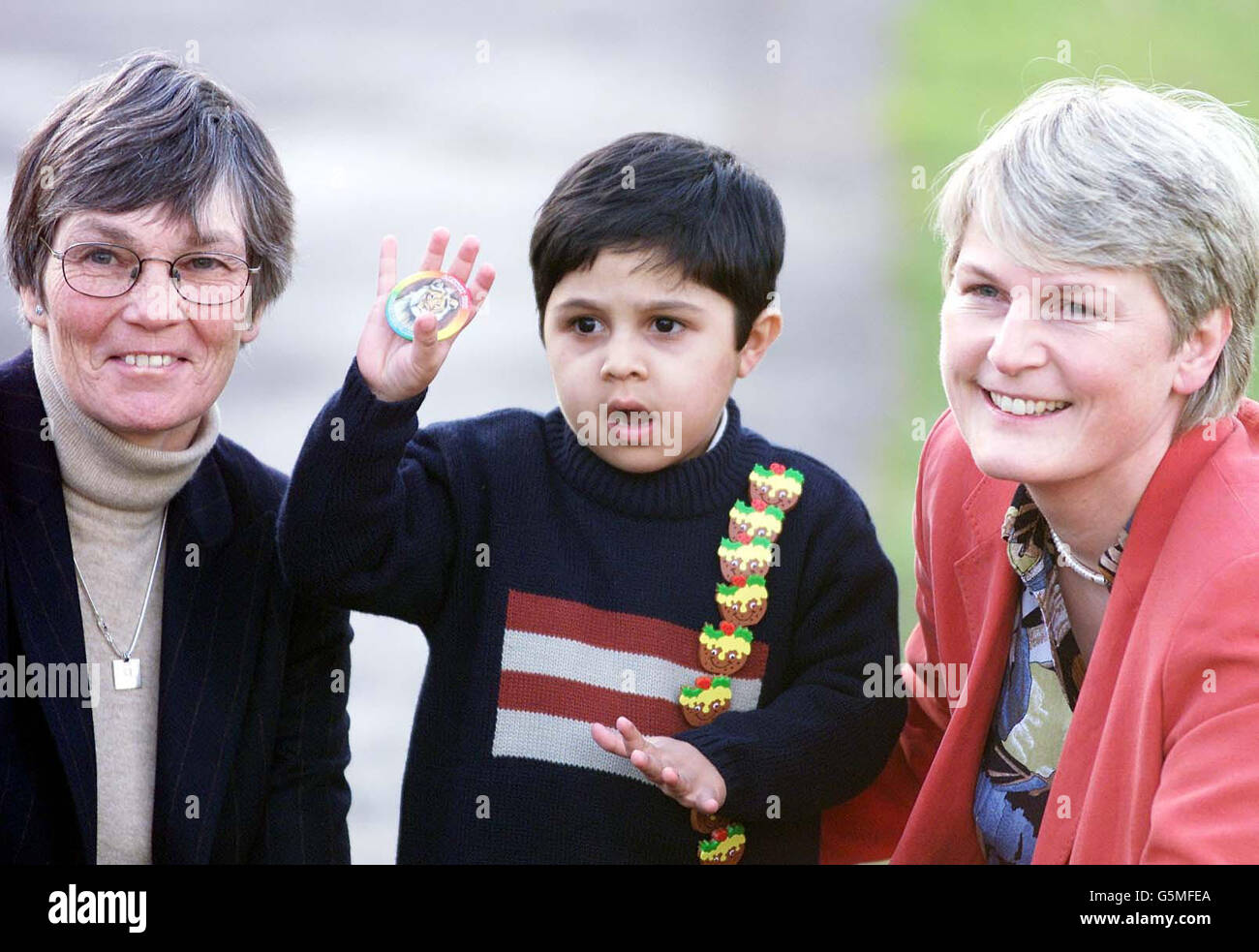 Four year old cancer patient Mohammed, outside the Cancer research campaign office in London's Regents Park after receiving a revolutionary treatment at Birmingham's Children's Hospital, which has saved his life. *Pictured here with leading scientist Professor Dorothy Crawford (left) and Dr Sue Beath of Birmingham's Childrens hospital (right). The cytotoxic T cell therapy which uses specially selected blood cells to boost the body's natural immune system and fight off the disease was used following a combined liver and small bowel transplant. See PA story HEALTH Cancer. PA Photo: Sean Dempsey. Stock Photo