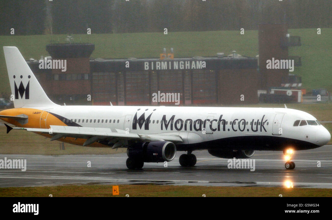 A Monarch Airways plane lands at a wet Birmingham Airport today as the aircraft maintenance division of the travel group has announced plans to build a new facility at Birmingham Airport, creating up to 300 jobs. Stock Photo