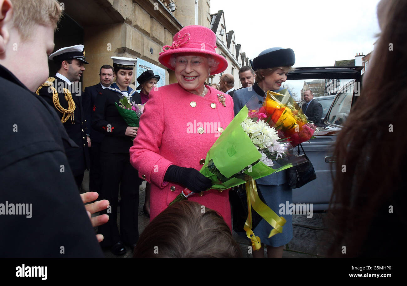 Queen Elizabeth II is given flowers as she leaves the recently refurbished Bristol Old Vic Theatre. Stock Photo