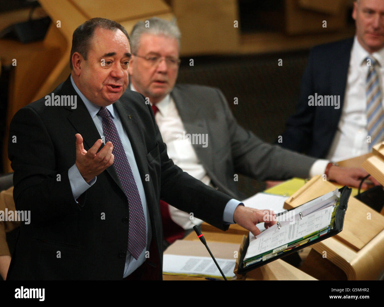 Scottish First Minister Alex Salmond and Education Secretary Mike Russell during First Minister's Questions at the Scottish Parliament in Edinburgh. Stock Photo