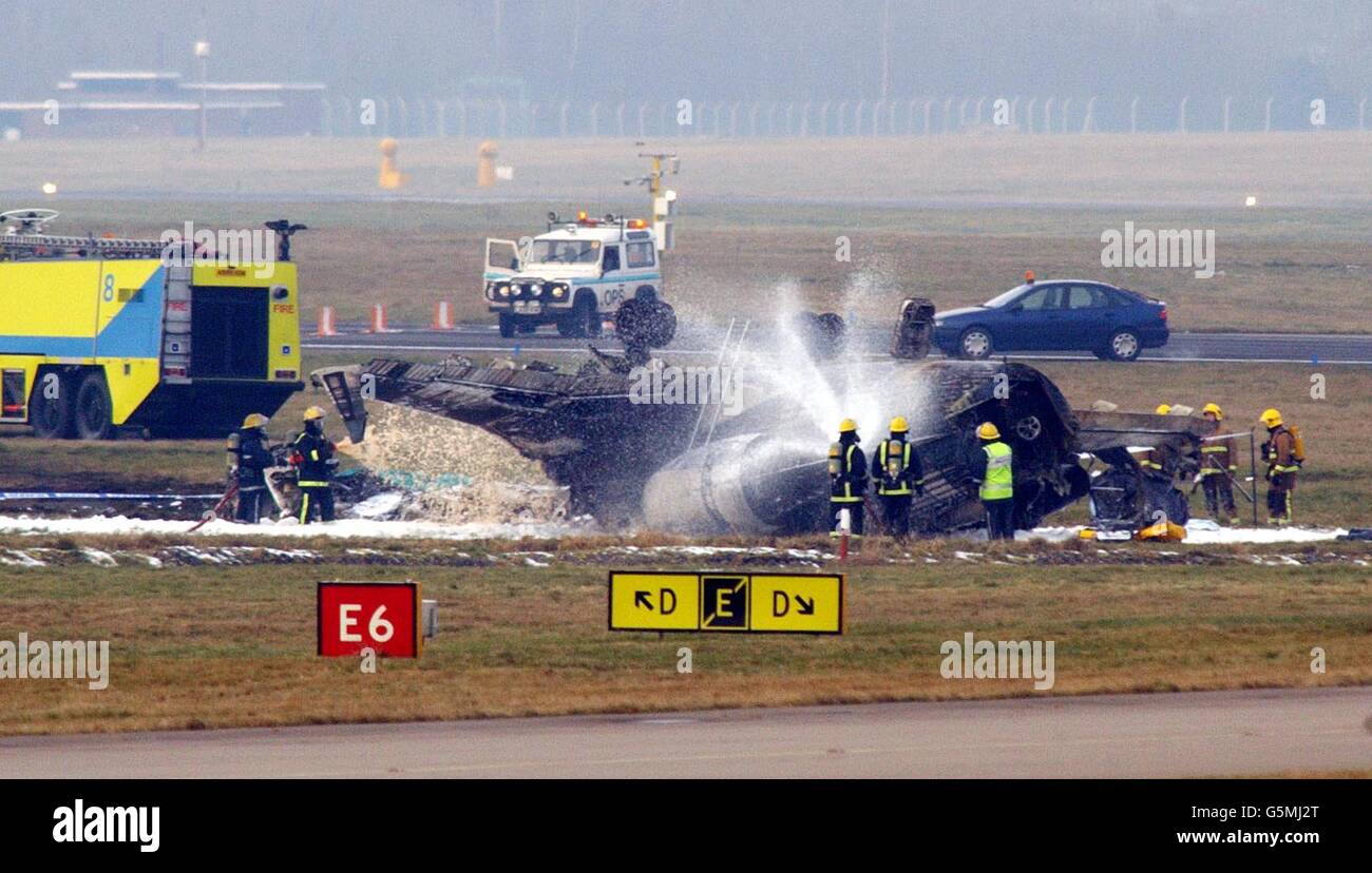 The scene at Birmingham International Airport where five people were feared dead after a private executive jet crashed in a fireball during take-off. The plane carrying three crew and two passengers caught fire around 12.07pm. * West Midlands Ambulance Service said four people were feared dead and one person was thought to be missing. It was understood that the plane, a twin-engined Canadair Challenger executive jet, was taking off bound for Bangor, Maine, USA - the town where the plane was believed to have been registered. Eyewitnesses reported seeing one of the jet's wing tips touching the Stock Photo