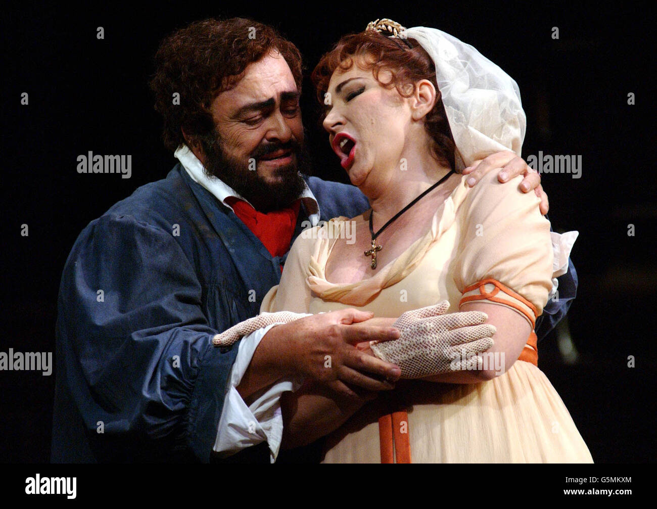 Italian tenor Luciano Pavarotti playing the role of Cavaradossi and Carol Vaness who plays Tosca rehearse the opera Tosca at the Royal Opera House in London's Covent Garden. Stock Photo