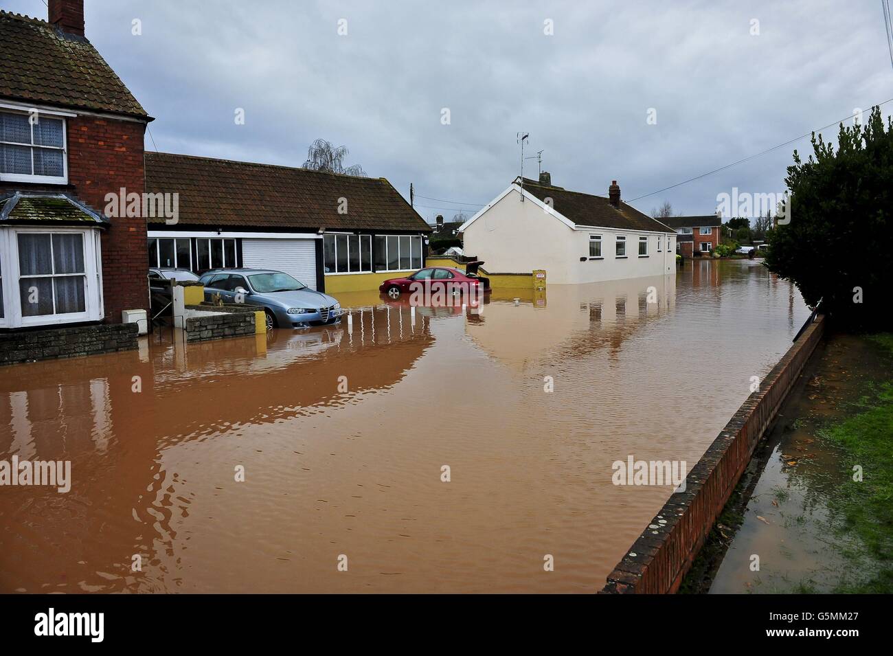 Homes flooded on Cheats Road in the Somerset village of Ruishton, near Taunton, which has been flooded after the River Tone burst it's banks. Stock Photo