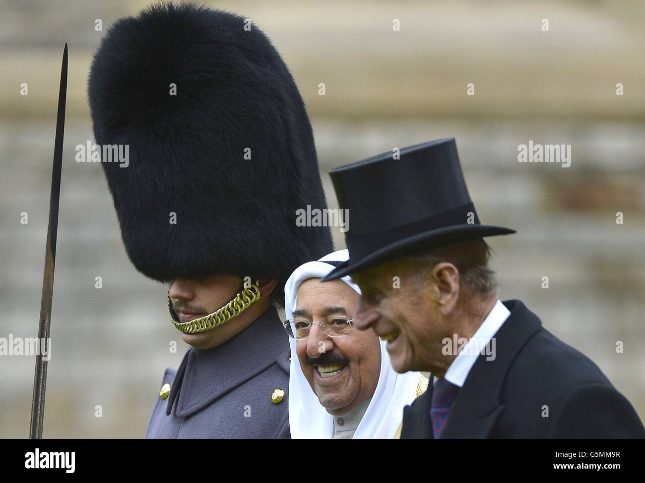 The Amir of the State of Kuwait, His Highness Sheikh Sabah Al-Ahmad Al-Jaber Al-Sabah, walks with the Duke of Edinburgh as they inspect members of the 1st Battalion Irish Guards, at Windsor Castle during the first day of his State Visit to the UK. Stock Photo