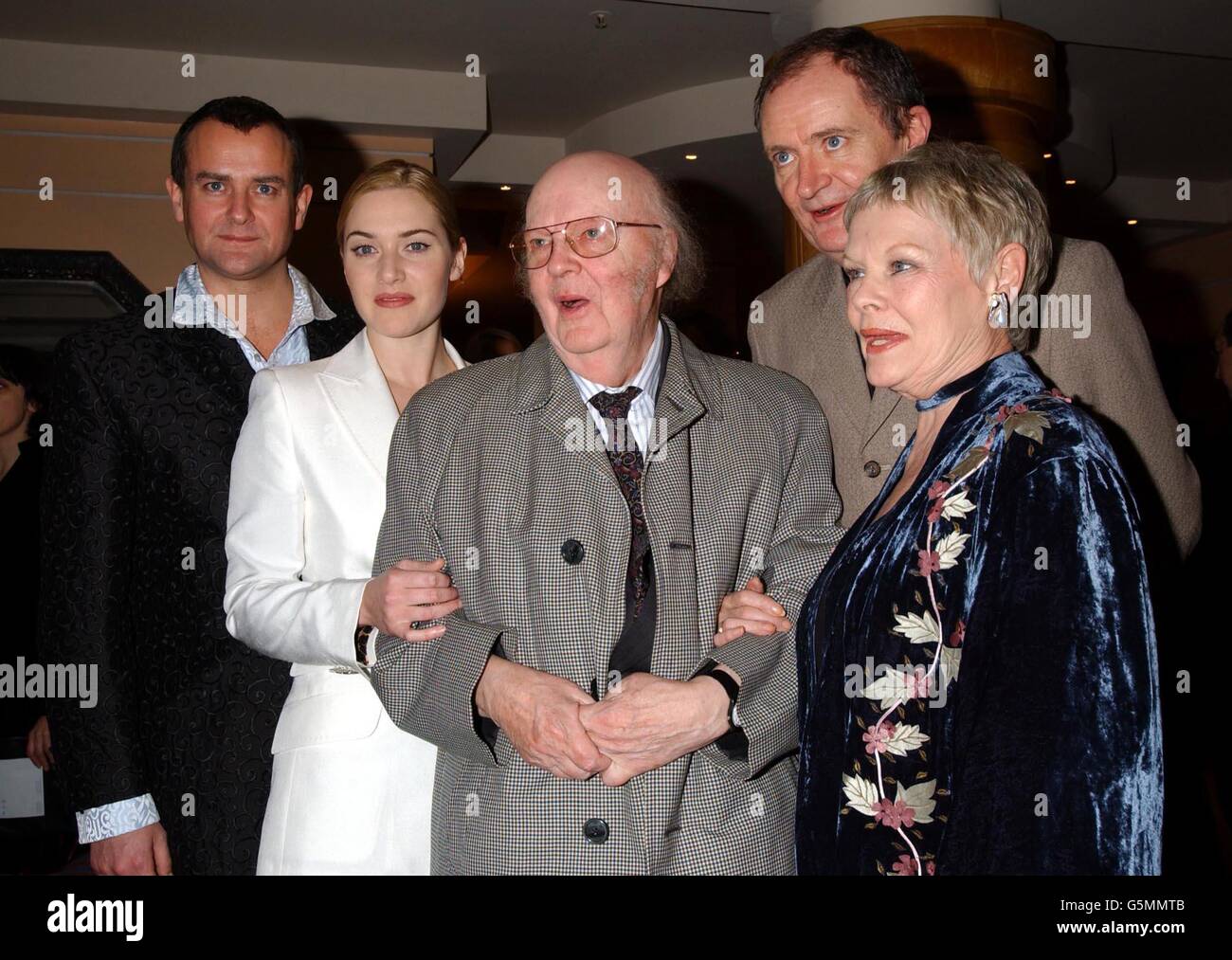 John Bayley (C) husband of the late Dame Iris Murdoch, with stars of the film, (L-R) Hugh Bonneville, Kate Winslet, Jim Broadbent and Dame Judi Dench during a press reception at the Washington Hotel in central London, ahead of the premiere of 'Iris' at the Curzon Mayfair. * The film follows the story of Booker Prize-winning novelist and philosopher Iris Murdoch who died in 1999, played by Kate Winslet and Judi Dench. Stock Photo