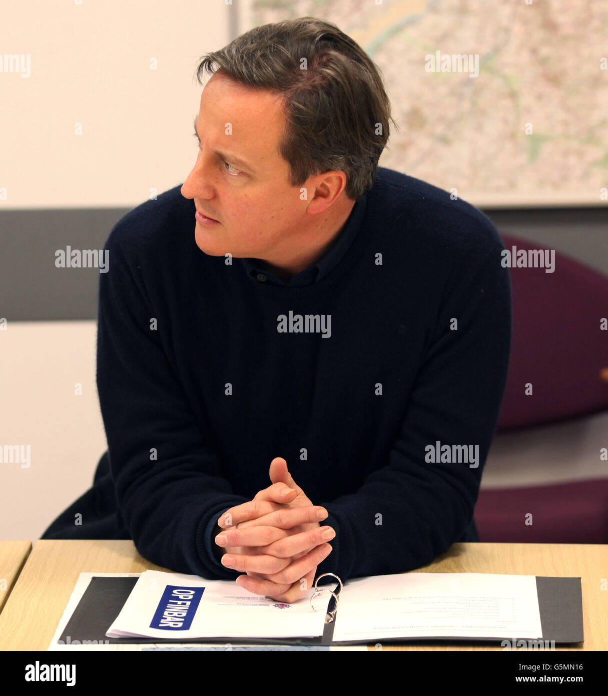 Prime Minister David Cameron attends a Silver Command at Gloucestershire Police Head Quarters where Multi- Agency staff have been working to tackle the flooding that has hit the area. Stock Photo
