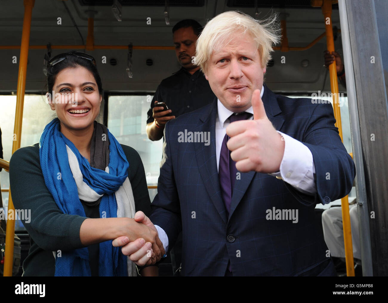 Mayor of London Boris Johnson bumps into Bollywood actress Kajol as he arrives in Mumbai today. The famous Indian actress happened to be on the same flight as the Mayor who was travelling from Hyderabad to Mumbai as part of a week long tour of India where he is trying to persuade Indian businesses to invest in London. Stock Photo