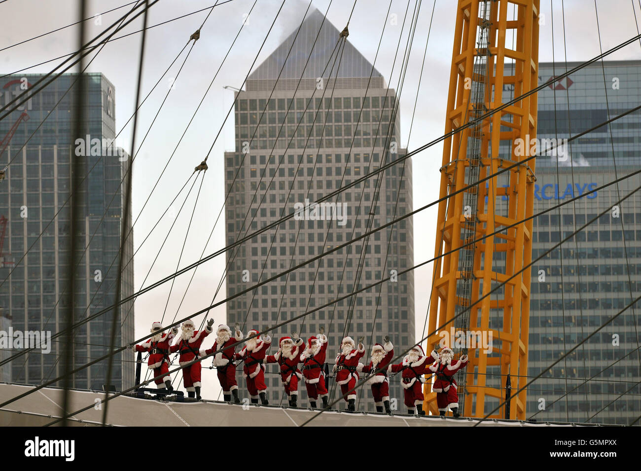 Ten professional Santas finish their preChristmas training by scaling