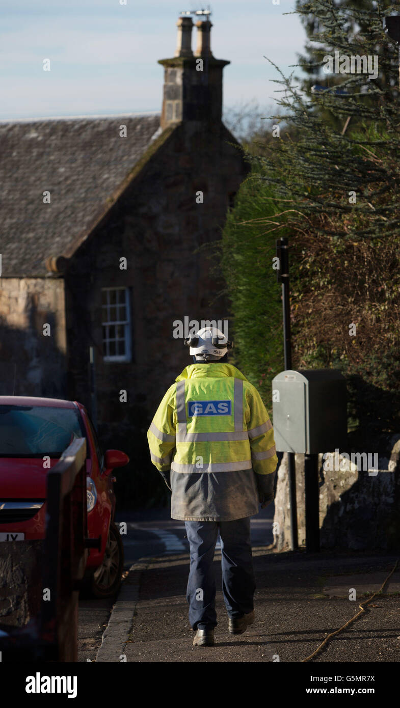 A Scotland Gas Networks employee works to restore gas to a house in Dollar as 2,500 homes remain without central heating or hot water for a third day. Stock Photo
