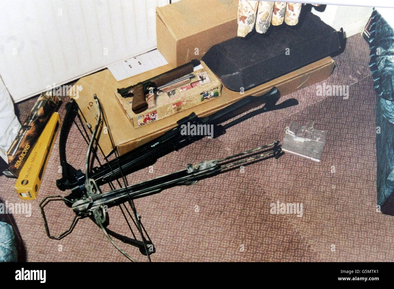 Undated collect of the arsenal of weapons used by Mark Telford to shoot two horses, issued Wednesday January 23, 2002. Plumber Mark Telford, 28, was jailed today at Newcastle Crown Court for a total of 2 years for criminal damage and firearms offences after shooting the horses with a crossbow. In March 2000 a three-year-old mare, Frisco, was found in her field with 18-inch bolts sticking out of her neck and rib cage, and Prince, a five-year-old gelding, had been shot between the eyes. Telford was described as being fascinated by weapons and was told by Judge Lancaster that he had an unhealthy Stock Photo