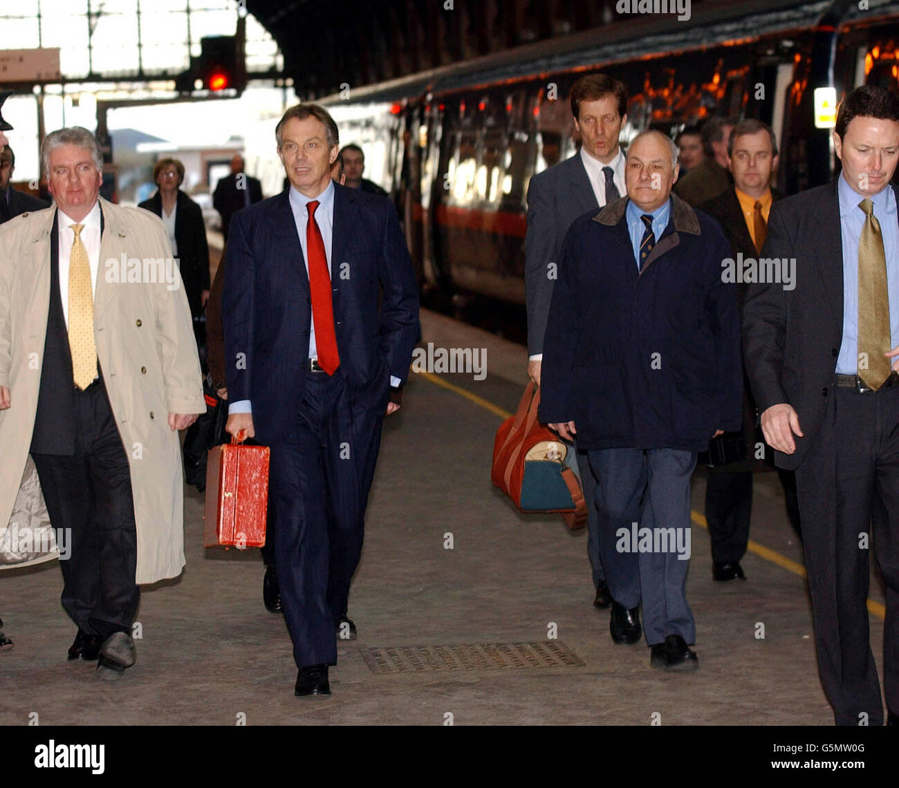 Prime Minister Tony Blair walks along the platform after travelling from London on a GNER train to Darlington, for a visit to north-east England. Another train company - Arriva Trains Northern - cancelled most of its 1,600 services. * ... because of a walkout by guards and conductors. Earlier, an interview with the Prime Minister on the Jimmy Young show had been dominated by the row over Downing Street's decision to relate medical details of NHS patients whose relatives had complained about the their treatment to the media. Stock Photo