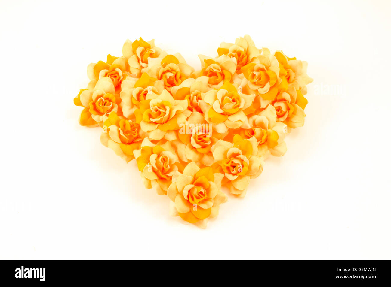 Orange flowers arranged in a heart Stock Photo