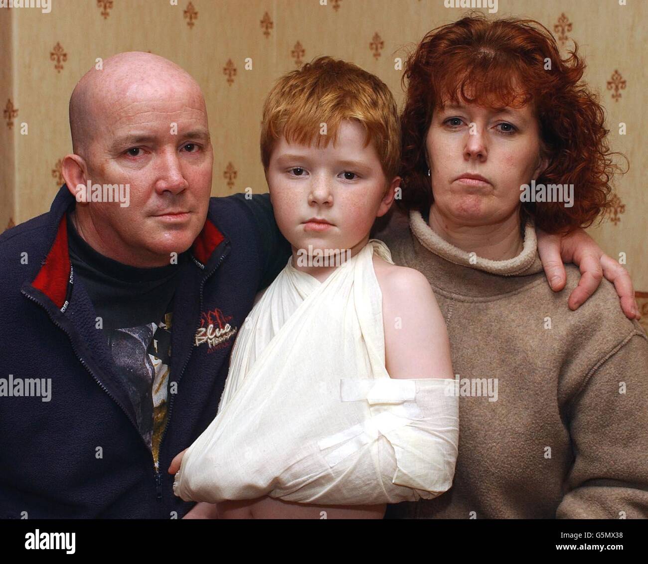 Josh Campbell, of Wallsend, Newcastle-upon-Tyne, photographed at his home with his mother Valerie and father Paul. The mother of a nine-year-old boy who was sent home from hospital by doctors who failed to spot his broken collarbone launched an attack. * on the NHS. Josh Campbell, of Wallsend, Newcastle-upon-Tyne, was left in agony after staff at North Tyneside Hospital refused to X-ray his shoulder after a playground fall. Stock Photo
