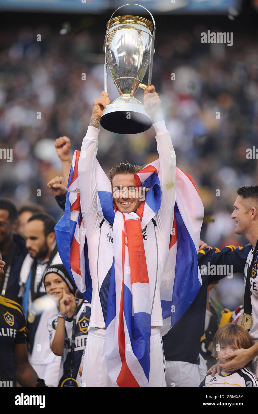 LA Galaxy's David Beckham lifts the trophy after winning the MLS Cup Final at the Home Depot Center, Los Angeles, USA. Stock Photo