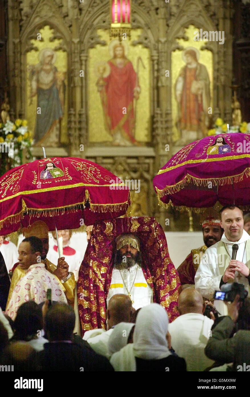 Ethiopian priest Arch Mandrite Abba Markos (C), carries the Tabot, wrapped in ceremonial clothes, on his head during the handing over ceremony for the sacred artefact at St John's Scottish Episcopal church in Edinburgh. * A group of Ethiopian priests and officials arrived in the UK to retrieve the sacred carving stolen from their country 130 years ago. The wooden tablet depicting the Ark of the Covenant, known as a Tabot, was seized by British soldiers during a bloody battle in Ethiopia in 1868 when an expeditionary force was sent to the African country. The Tabot was brought to the Princes Stock Photo