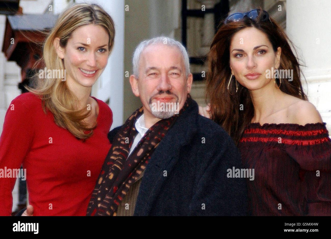 Actor Simon Callow flanked by models Lisa Butcher (left) and Saffron Aldridge, during a photocall outside the Theatre Royal in London's Covent Garden, to promote 'An Enchanted Evening' a charity gala concert to celebrate the 20th birthday of the Neurofibromatosis Association. * The concert, directed by Simon Callow, is due to take place on May 5, 2002 at the Theatre Royal. Stock Photo