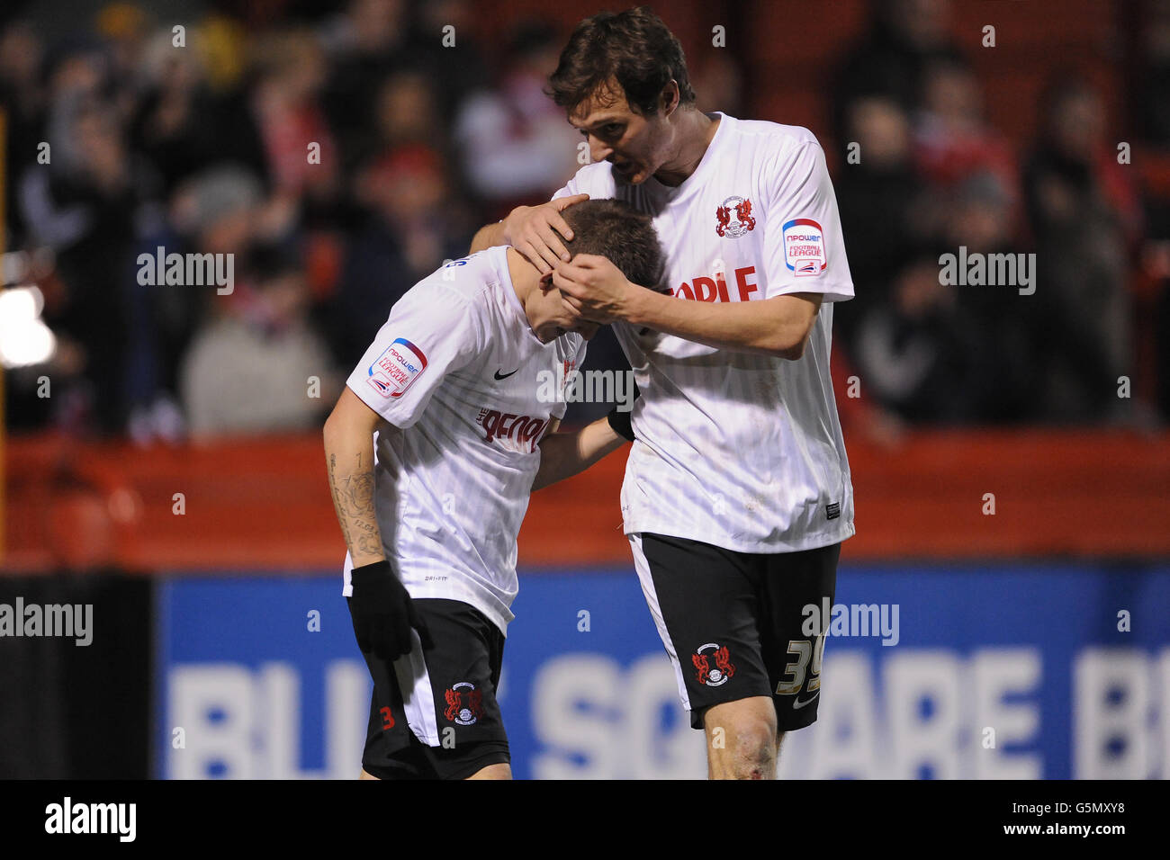 Leyton Orient's Dean Cox (left) celebrates scoring his teams fourth goal of the game with teammate David Mooney (right) Stock Photo