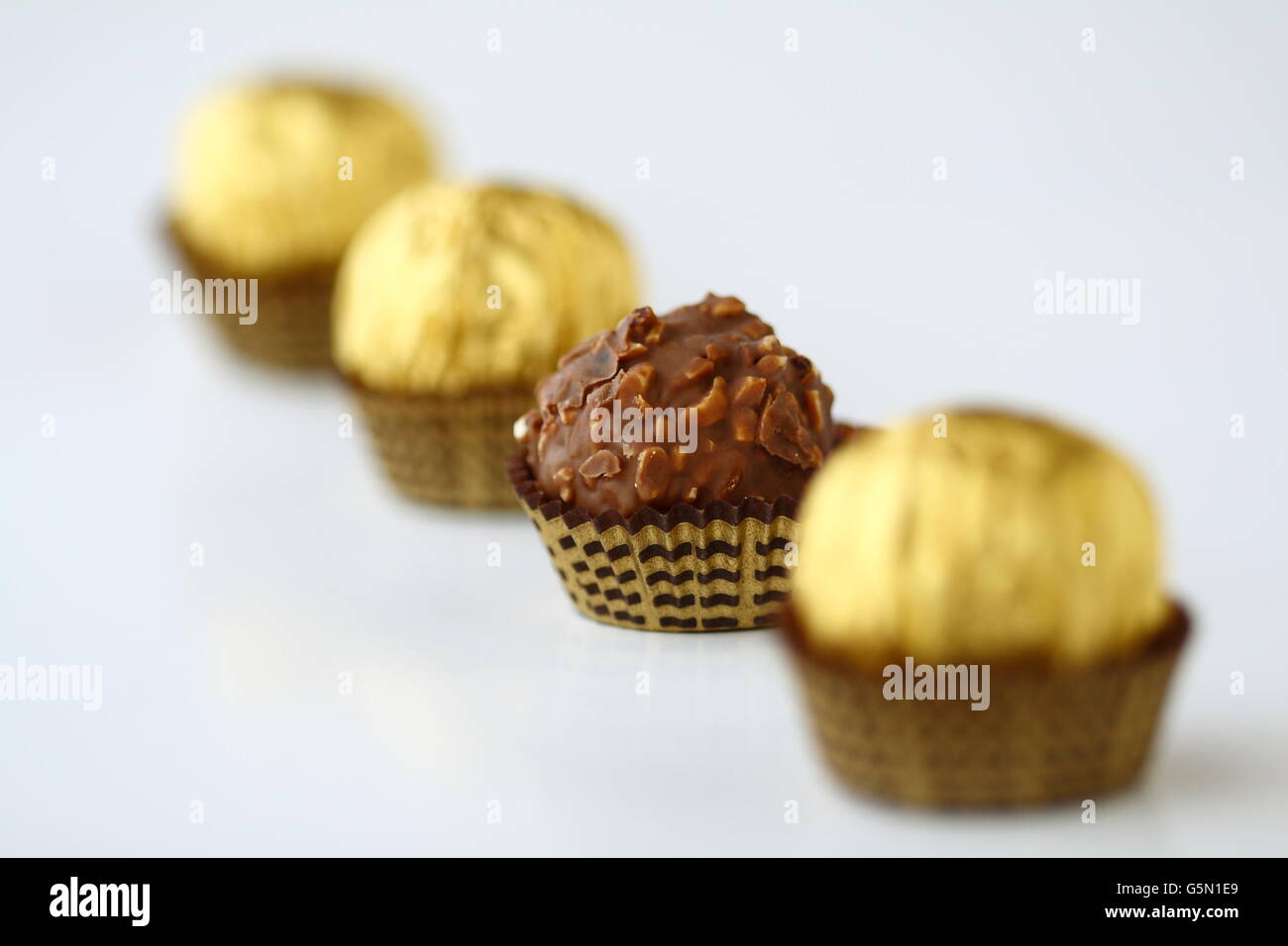 Close up of Chocolates individually wrapped in gold metallic wrapper