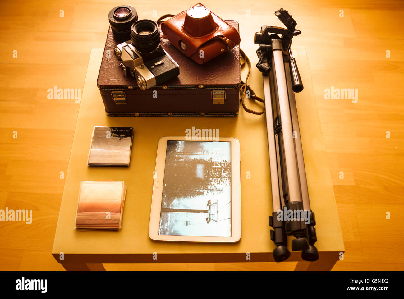 Camera equipment and digital tablet on table Stock Photo