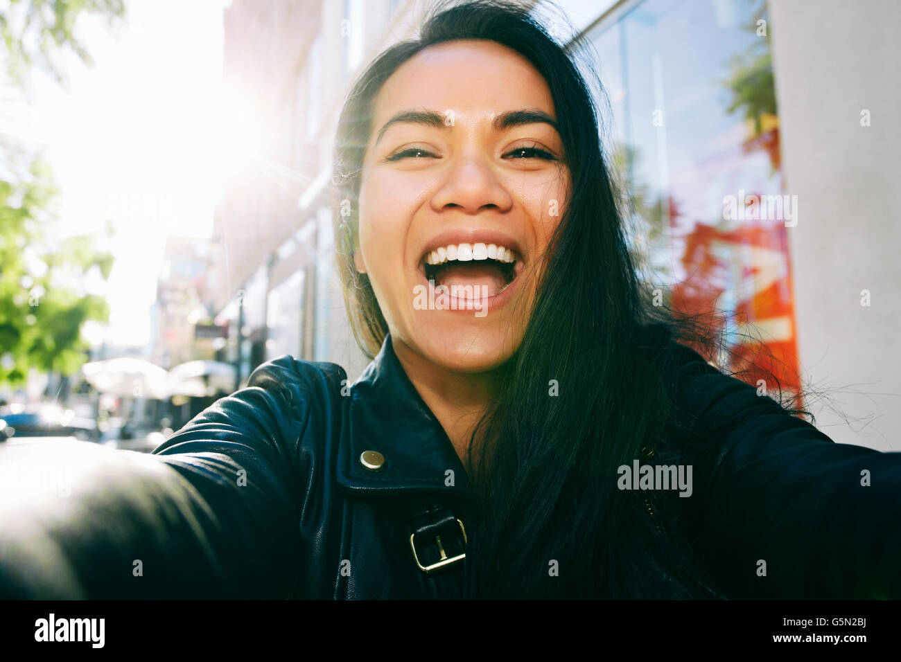 Asian woman in leather jacket hi-res stock photography and images - Alamy
