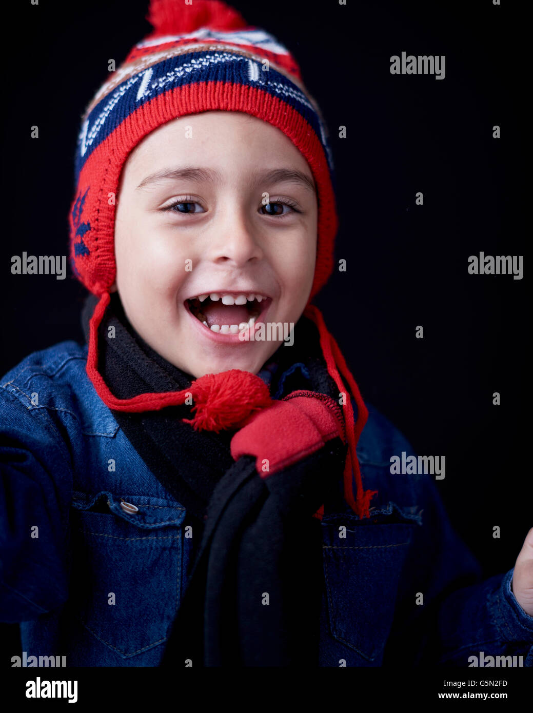 Close up of Hispanic boy wearing warm clothing Stock Photo