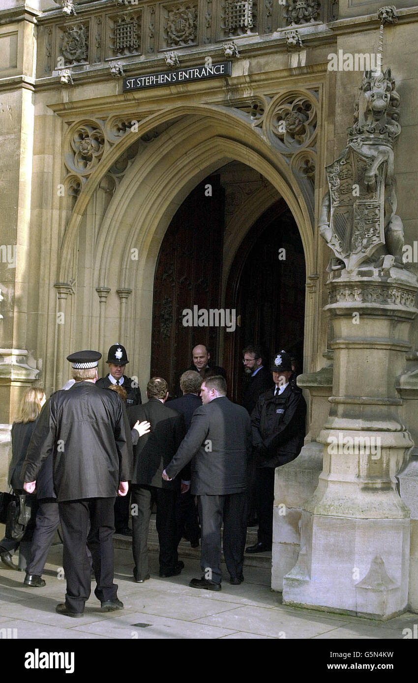 Sinn Fein President Gerry Adams MP (right) stands in the doorway of the St Stephens Entrance at the Houses of Parliament in London. Mr Adams and three other Sinn Fein MP's, including Martin McGuiness, have been granted office space within the Palace of Westminster. * At a press conference, Mr Adams said Sinn Fein MPs would never formally take up seats in the British Parliament. He said his party wanted to use the Commons facilities as a benchhead towards engaging in dialogue on the peace process and the cause of a United Ireland. Stock Photo