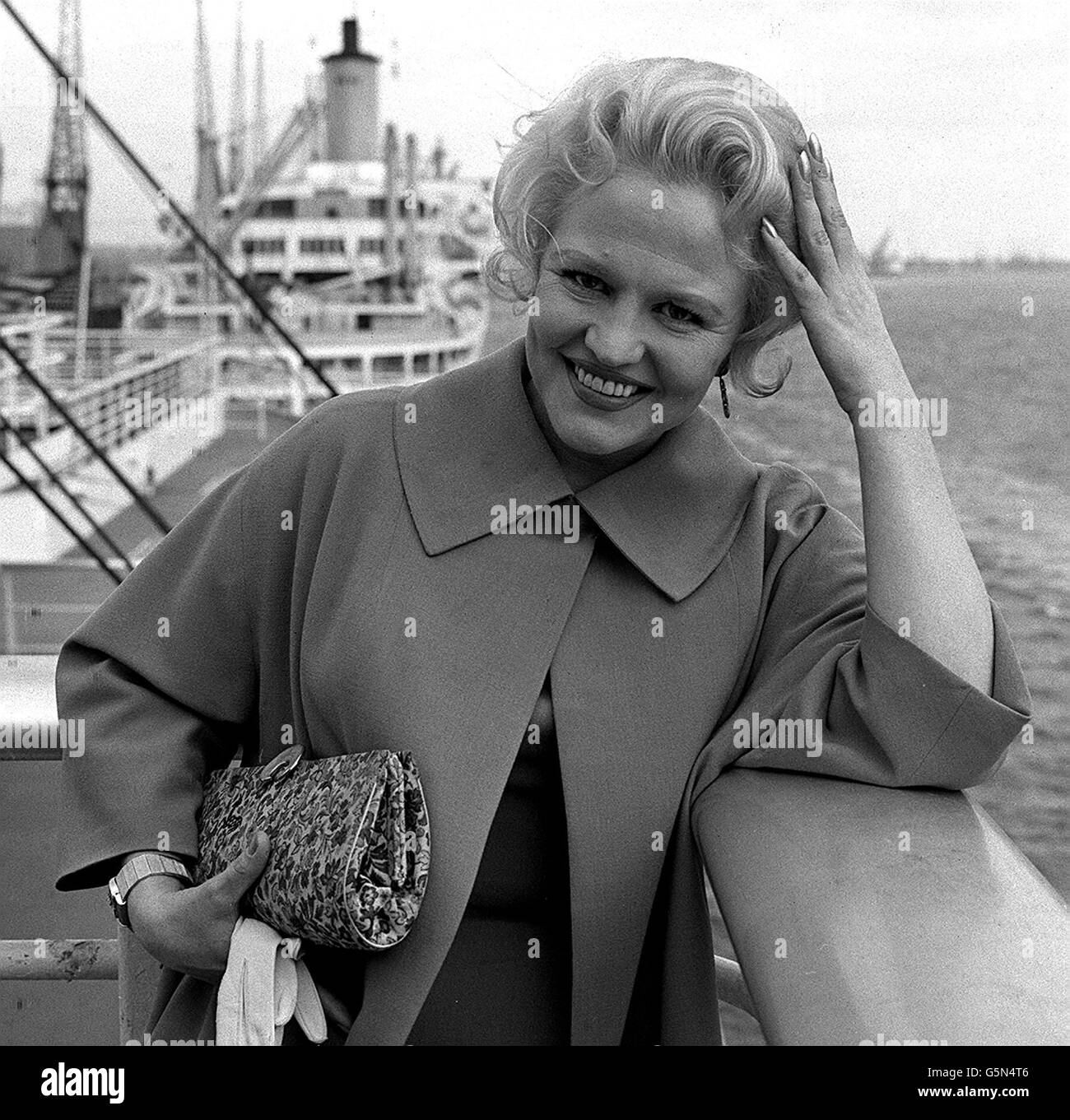 American sining star Peggy Lee as she arrives in Southampton from the USA to begin a three week season at the Pigalle in London. 22/01/02: American singing star Peggy Lee whose smoky voice in such songs as That All There Is? and Fever made her a jazz and pop legend, has died. *... it was announced. Lee died from a heart attack at her home in Bel Air, Los Angeles, said her daughter, Nicki Lee Foster. Lee repeatedly battled injury and ill health, including heart trouble, in order to maintain a career that brought her a Grammy, an Oscar nomination and sold-out houses worldwide. She was 81. Stock Photo
