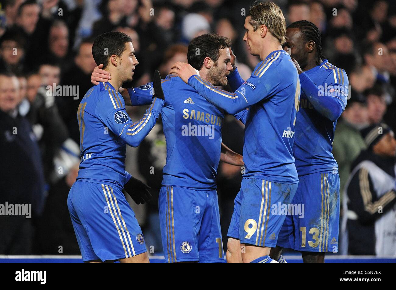Chelsea's Juan Mata (centre) celebrates scoring their fifth goal of the game with team-mates Stock Photo