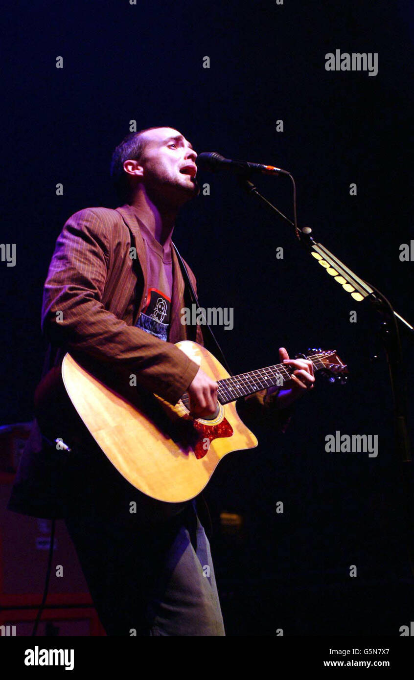 Lead singer Fran Healy, of the Scottish pop band Travis, performing on stage at The Astoria, in central London, as part of the NME Carling Awards Shows. Stock Photo