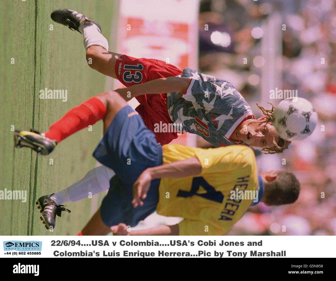 Soccer - World Cup USA 94 - Group A - USA v Colombia. USA's Cobi Jones and Colombia's Luis Enrique Herrera Stock Photo