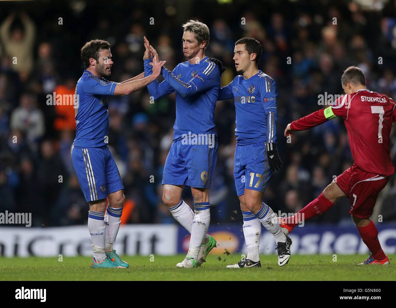 Chelsea's Fernando Torres (centre) celebrates with team-mates Juan Mata (left) and Eden Hazard (second right) after scoring his team's second goal Stock Photo