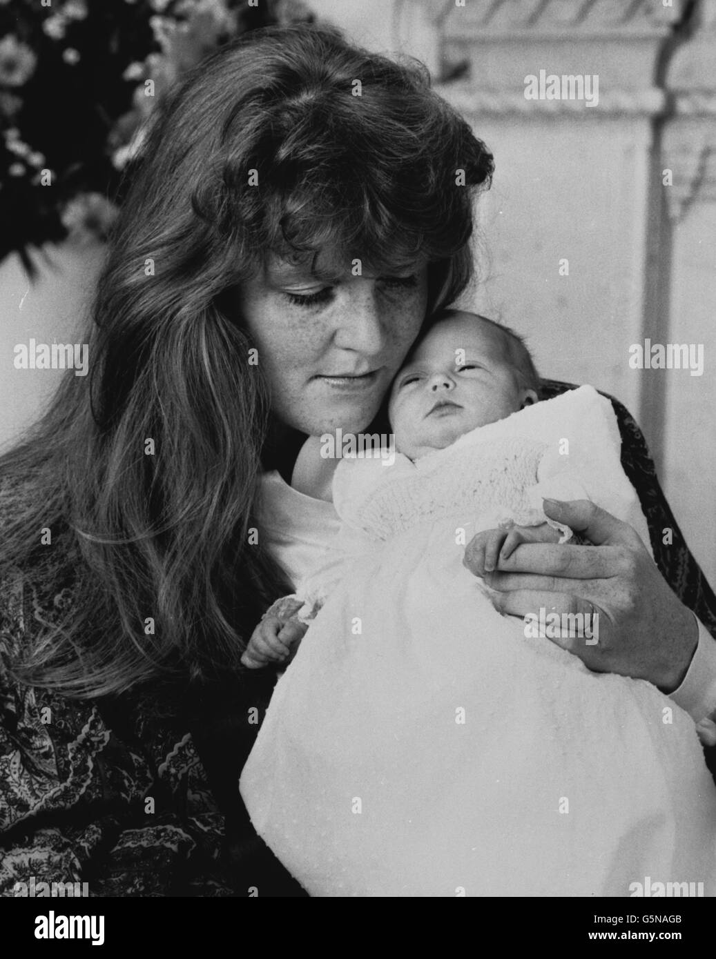 One of the first two official photographs by the Duke of York of his two-week-old daughter, her Royal Highness the Princess Beatrice of York in the arms of her mother, the Duchess of York, at Balmoral. *Low res scan - Hi res scan on request Stock Photo