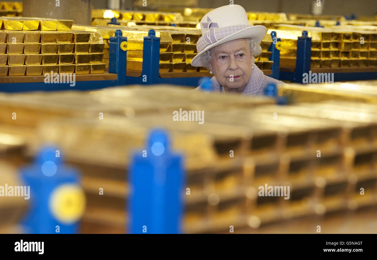 Queen Elizabeth II tours the gold vault during her visit to the Bank of England in central London. Stock Photo