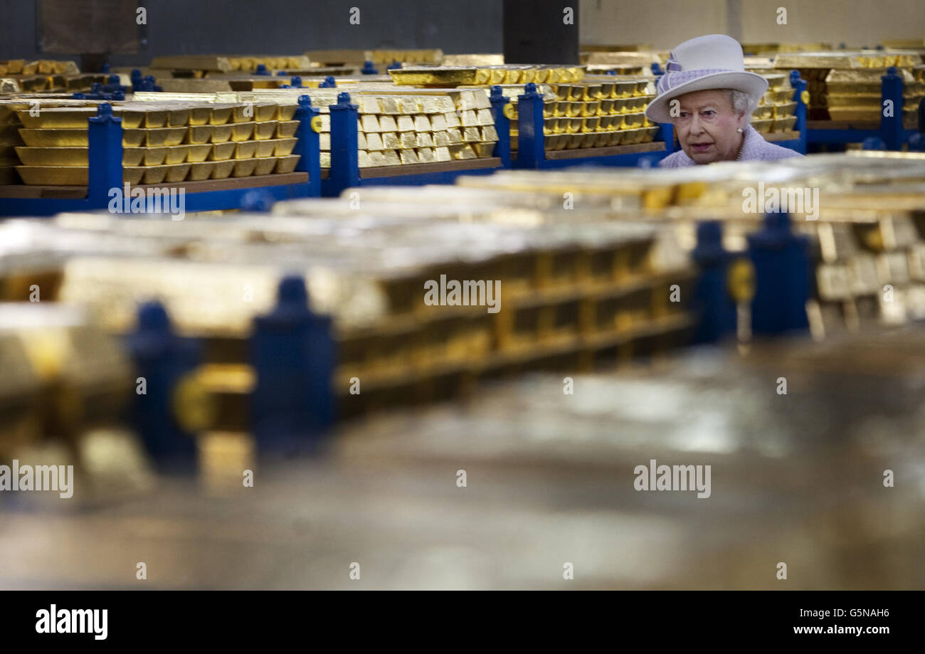 Queen Elizabeth II tours the gold vault during her visit to the Bank of England in central London. Stock Photo