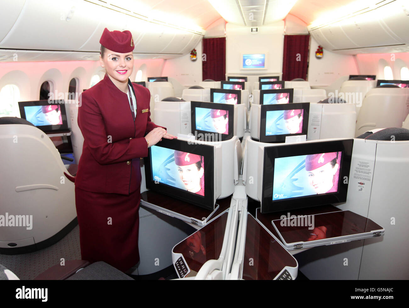 Claire Andrews, Qatar Airways stewardess in the business class section of the 787 Dreamliner at London's Heathrow Airport as Qatar becomes the first airline to operate regular scheduled flights with the 787 Dreamliner to and from the UK. Stock Photo