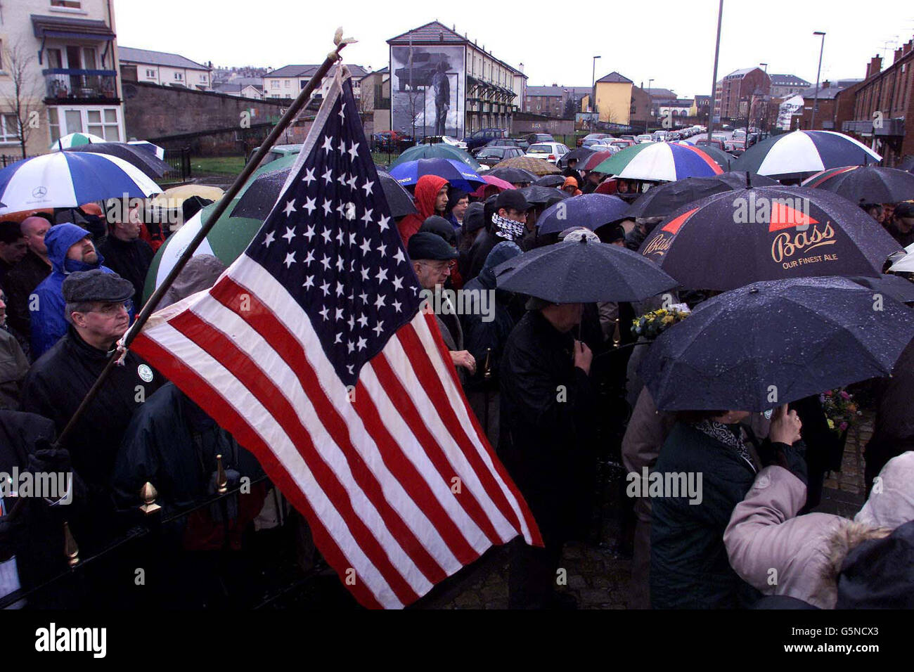 An American flag is waved at the service to mark the 30th anniversary of Bloody Sunday in Londonderry. Thousands of people gathered in Londonderry to retrace the ill-fated route of the Bloody Sunday march in 1972 where 13 people were shot dead. * ... by the Paratroop regiment. Stock Photo