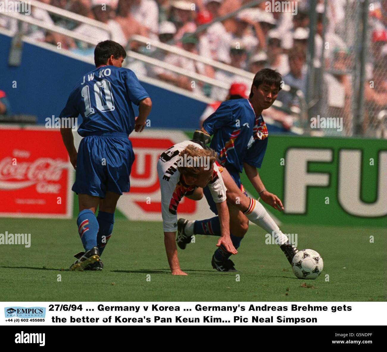 27/6/94, Germany v Korea, Germany's Andreas Brehme gets the better of Korea's Pan Keun Kim Stock Photo