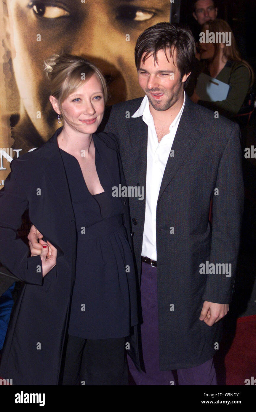 Pregnant actress Anne Heche with her husband Coley Laffoon arrives for the premiere of her new movie 'John Q' in Hollywood, California. Stock Photo