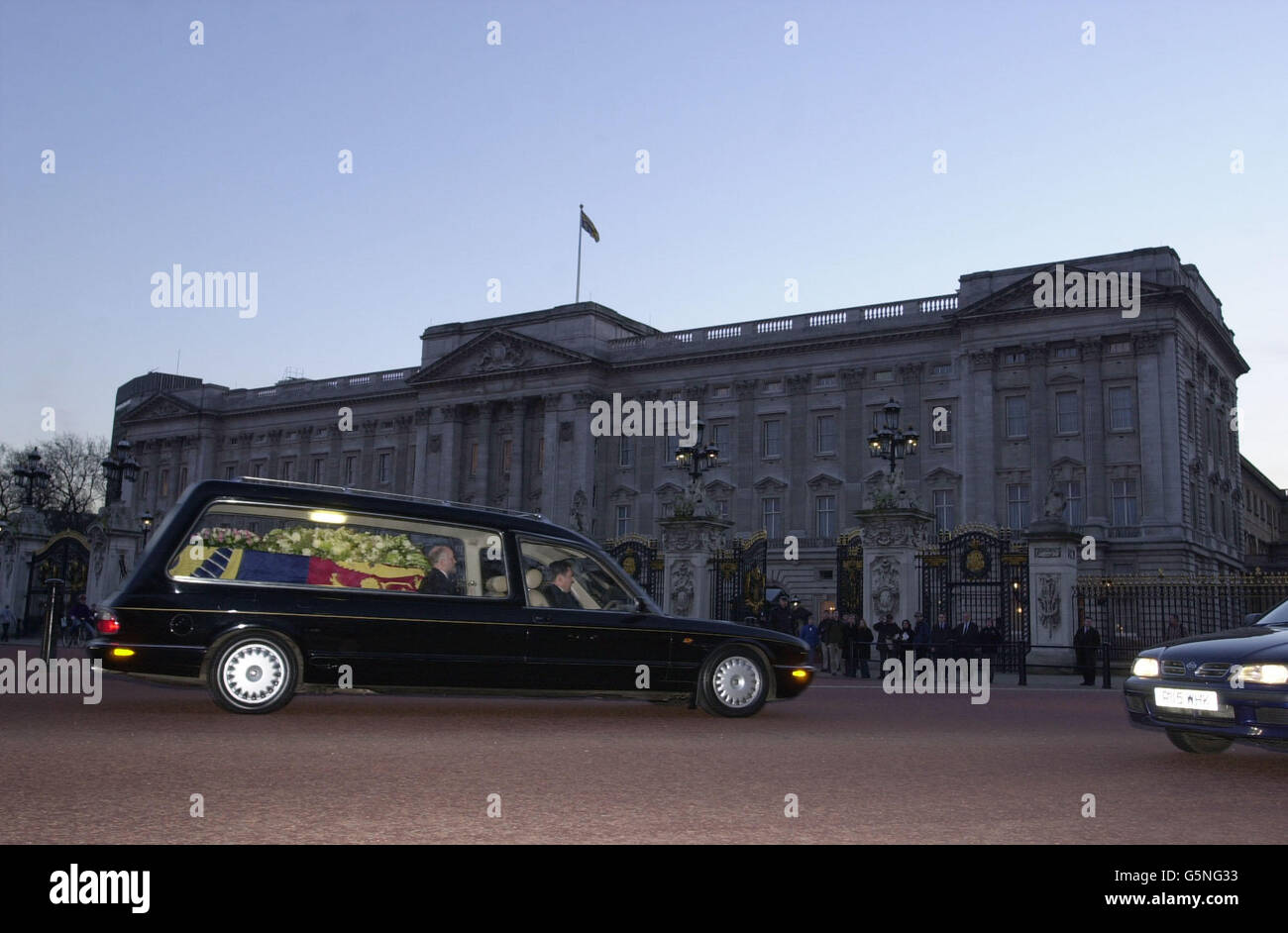 The hearse carrying the coffin of Princess Margaret - the younger sister of Britain's Queen Elizabeth II - passes Buckingham Palace, as it travels from The Queen's Chapel at St James's Palace to Windsor Castle for her funeral. Stock Photo