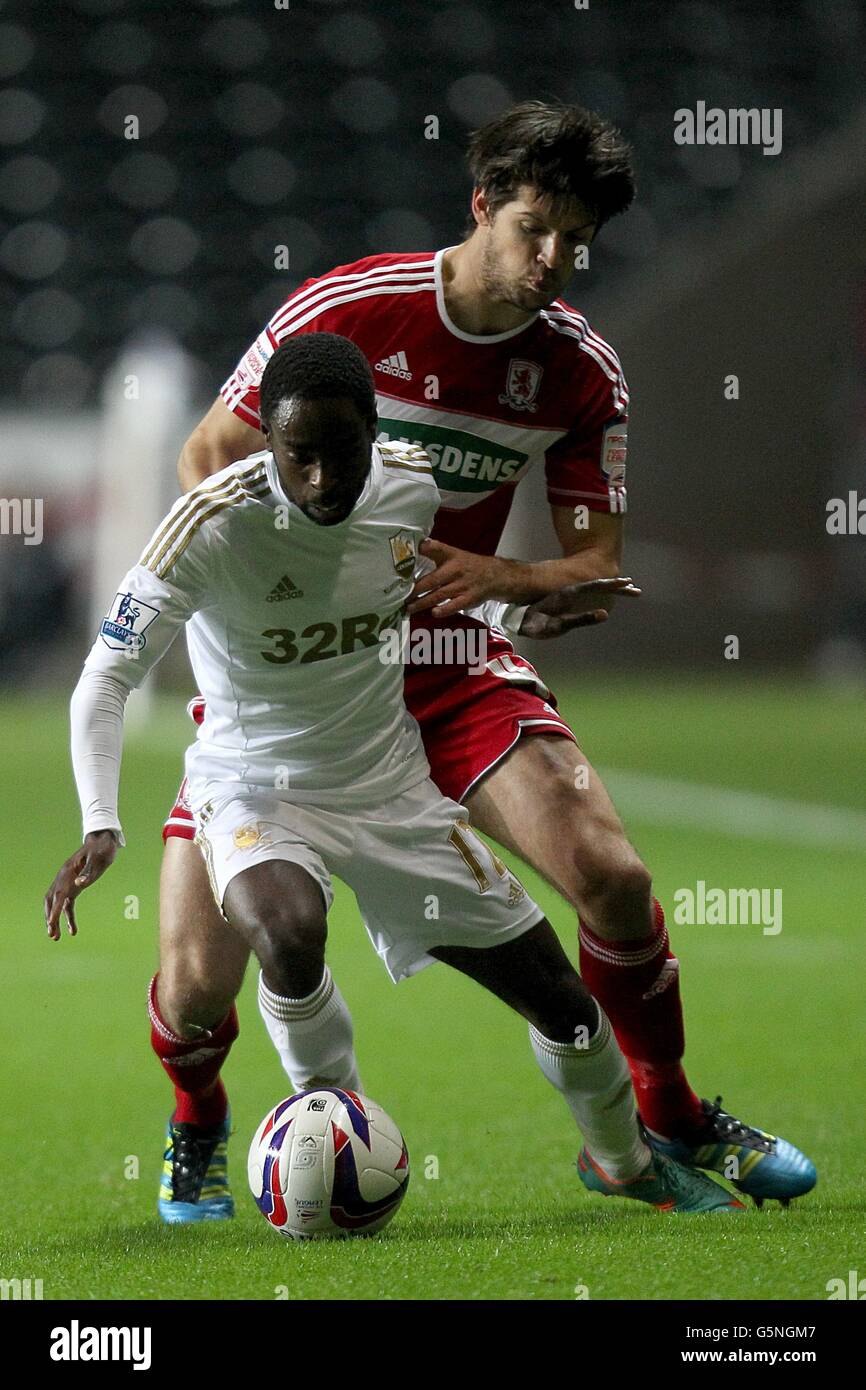 Soccer - Capital One Cup - Quarter Final - Swansea City v Middlesbrough - Liberty Stadium. Middlesbrough's George Friend (above) and Swansea City's Nathan Dyer (below) battle for the ball Stock Photo