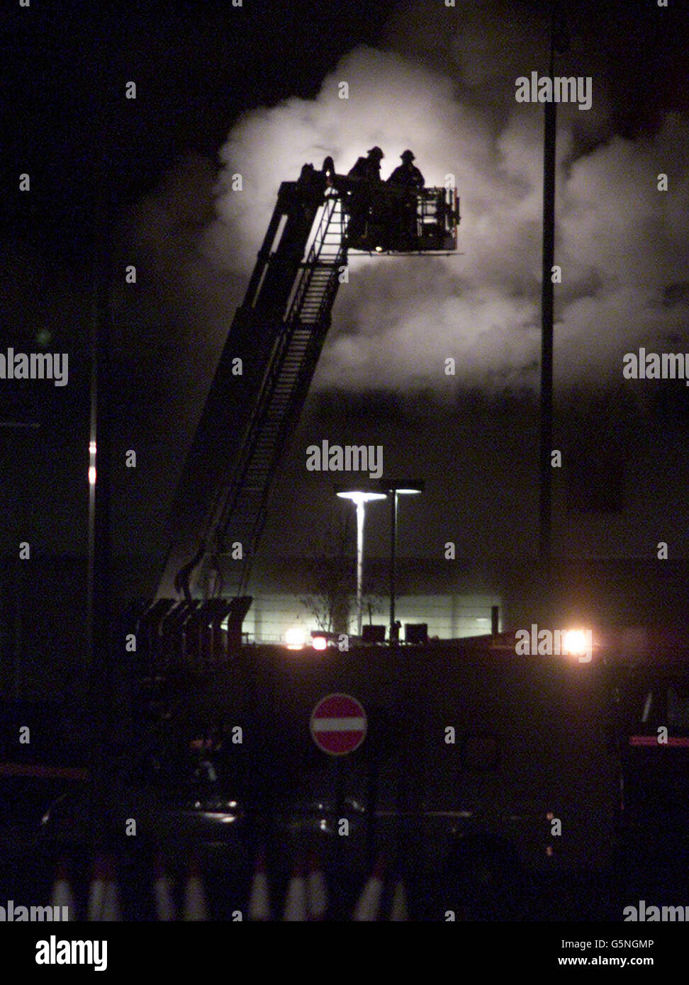 Smoke and flames pour from buildings after an attempted breakout from a detention centre housing asylum seekers sparked a major fire Thursday and left at least three people in hospital. A number of refugees are believed to have escaped from the Yarl's Wood centre near Bedford, * late on Thursday, in the confusion caused by several fires. Stock Photo