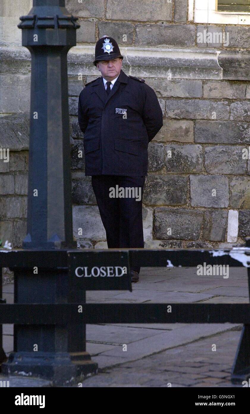 Police guard at the closed entrance to Windsor Castle ahead of the funeral of Princess Margaret - the younger sister of Britain's Queen Elizabeth II - who died last Saturday, aged 71. After the funeral in St George's chapel, she will be cremated at Slough Crematorium. Stock Photo