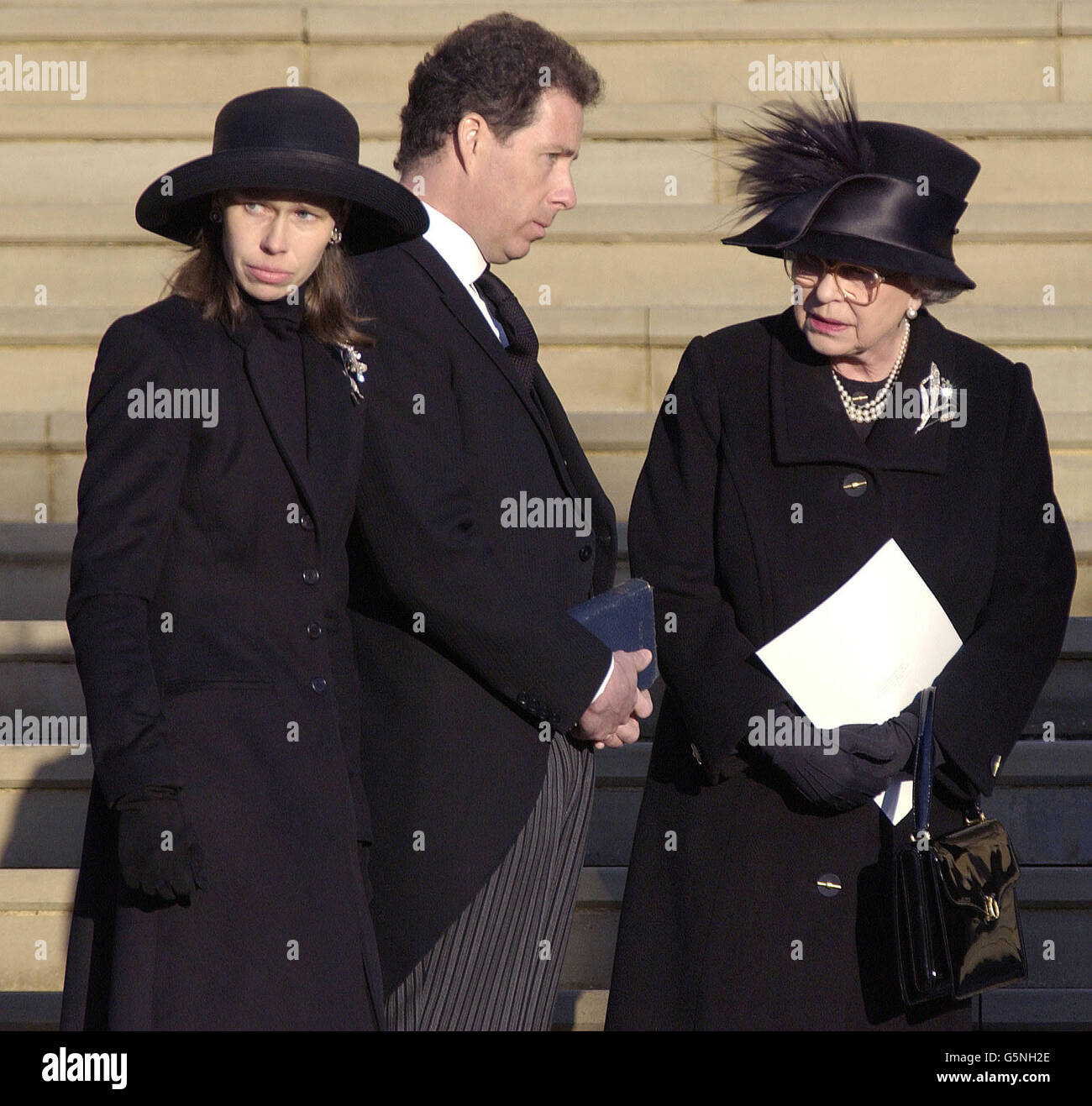 WARNING - NO CROPPING: Britain's Queen Elizabeth II (right) Viscount Linley (centre) and Sarah Chatto arrive for the funeral of Princess Margaret at St George's Chapel in Windsor Castle. Princess Margaret died aged 71. * Note to editors (not for publication): Photographers have been asked not to take close-up pictures of Princess Margaret's children and young people attending today's funeral. Editors are therefore asked NOT to substantially recrop this image* Stock Photo