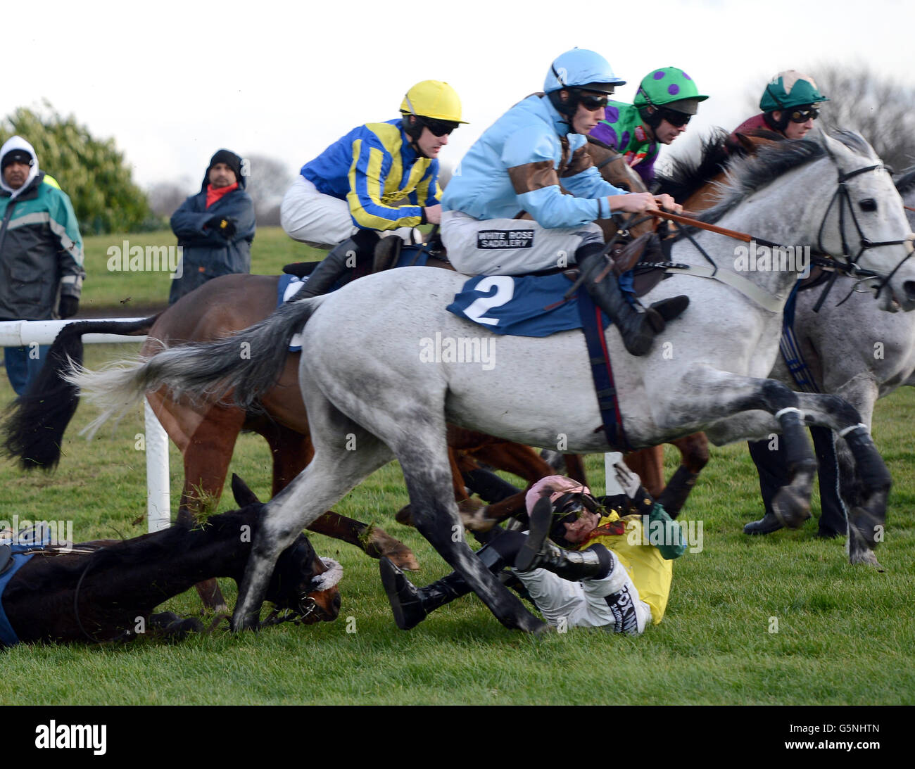 Battle Group and Tom Bellamy take a fall in the Follow At Racing On Twitter during the The BETVICTOR.COM Christmas National Hunt Meeting at Doncaster Racecourse Stock Photo - Alamy