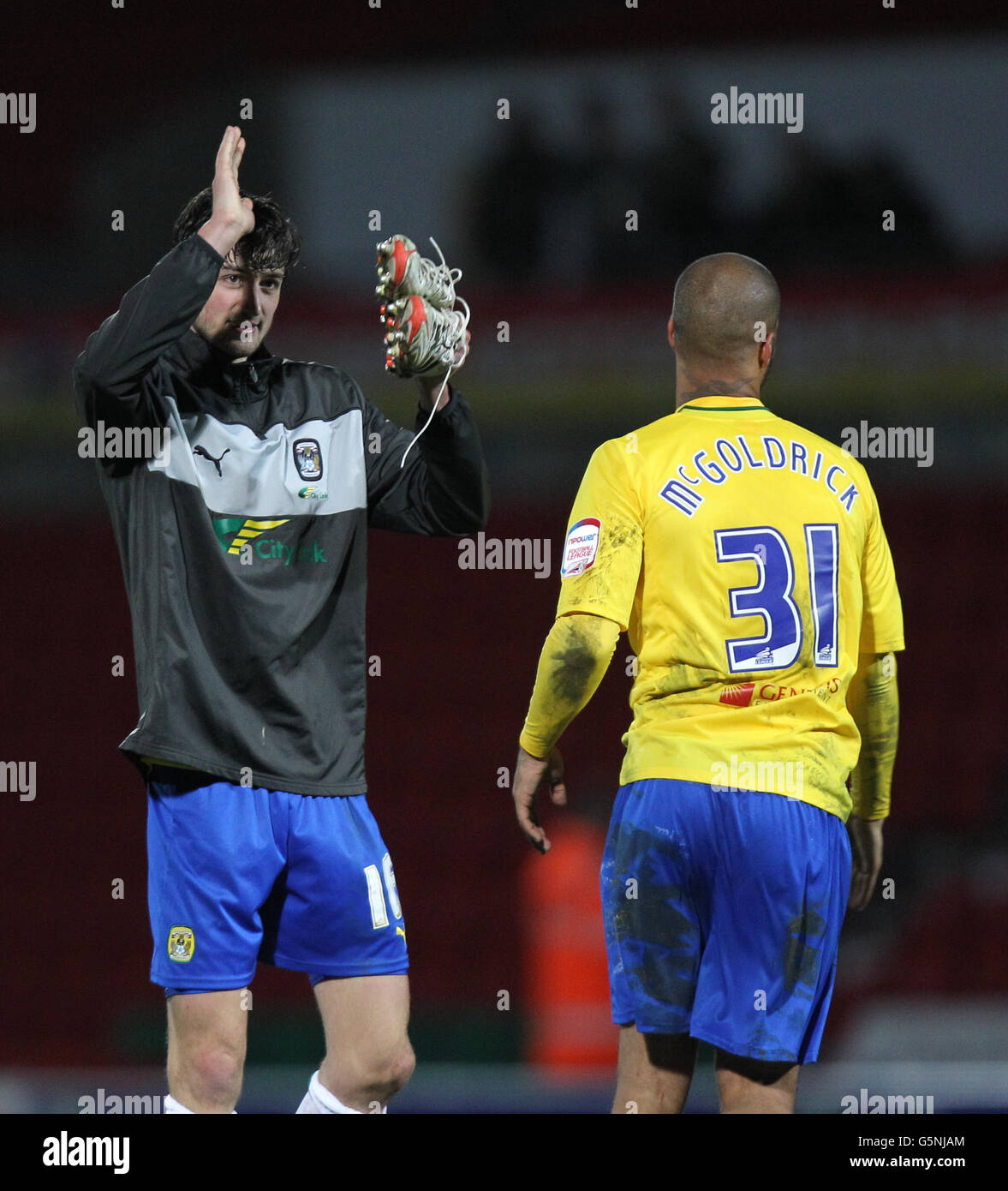 Goalscorer's Adam Barton and David McGoldrick at the end of the match during the npower Football League One match at the Keepmoat Stadium, Doncaster. Stock Photo